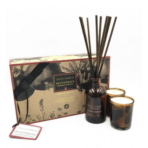 Celtic Candles Diffuser Set. Contains Diffuser in dark brown glass bottle, Dark brown reed sticks and 2 votive candles in brown glass holders. Soft Pomegranate and Black Spices Scent