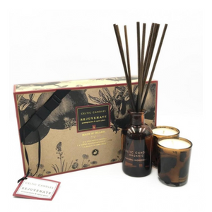 Celtic Candles Diffuser Set. Contains Diffuser in dark brown glass bottle, Dark brown reed sticks and 2 votive candles in brown glass holders. Soft Pomegranate and Black Spices Scent