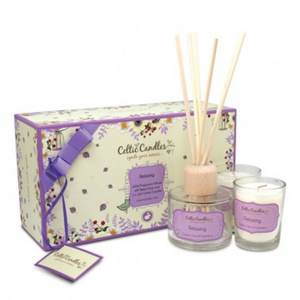 Celtic Candles Relaxing Gift Box contains natural oils of Clove Tarpenes, Turpentine, Mentha Arvensis, Geranium and Sweet Orange. Box includes a diffuser in clear glass, light brown reed sticks and 2 votive candles in clear glass holders. Flowery Box with a purple ribbon. 